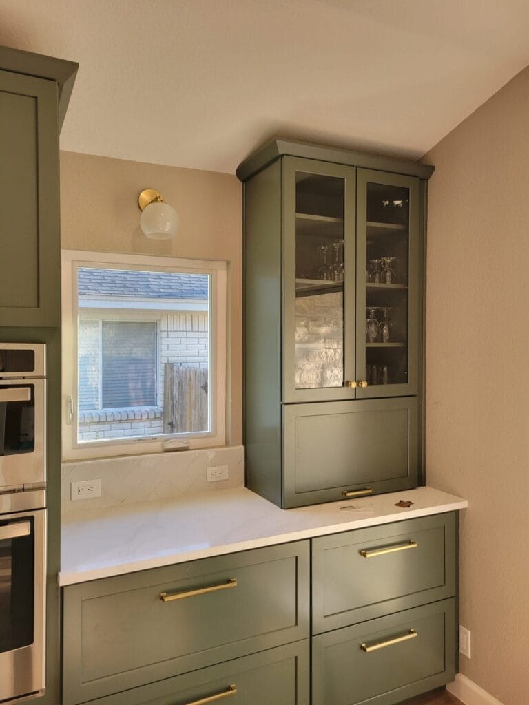Kitchen remodel featuring new cabinets, countertops, and a stylish backsplash for a refreshed and modern look.